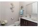 Modern bathroom with dark vanity and decorative wall art at 1316 Fountain Hills Ct, Winter Park, FL 32792