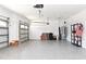 Two-car garage with epoxy flooring and storage shelves at 1316 Fountain Hills Ct, Winter Park, FL 32792