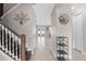 Spacious hallway with hardwood staircase and views to the living area at 1316 Fountain Hills Ct, Winter Park, FL 32792