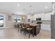 Modern kitchen with white cabinets, granite island, and stainless steel appliances at 1316 Fountain Hills Ct, Winter Park, FL 32792