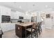 Spacious kitchen with island, white cabinets and stainless steel appliances at 1316 Fountain Hills Ct, Winter Park, FL 32792