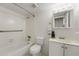 Clean bathroom with white vanity, tub, and shower at 134 Springwood Cir # E, Longwood, FL 32750