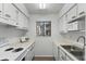 Efficient kitchen featuring white cabinetry and a microwave at 134 Springwood Cir # E, Longwood, FL 32750