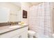 Bathroom with shower/tub combo and a vanity with countertop space at 2736 Bookmark Dr, Kissimmee, FL 34746