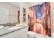 Bathroom with stylish shower curtain and a vanity with countertop space at 2736 Bookmark Dr, Kissimmee, FL 34746