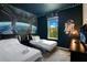Star Wars themed bedroom featuring twin beds, dark blue walls, and themed artwork at 2736 Bookmark Dr, Kissimmee, FL 34746
