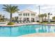 Resort-style community pool featuring plentiful seating, shade, and poolside bar at 2736 Bookmark Dr, Kissimmee, FL 34746