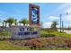 A picturesque welcome sign marks the entrance to Story Lake, adorned with lush landscaping at 2736 Bookmark Dr, Kissimmee, FL 34746