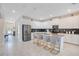 A modern, open concept kitchen with stainless steel appliances and a large central island with seating at 2736 Bookmark Dr, Kissimmee, FL 34746