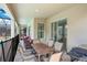 Spacious patio with an outdoor dining table and chairs adjacent to the pool area at 2736 Bookmark Dr, Kissimmee, FL 34746