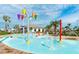 Delightful community water park featuring colorful buckets and fountains, creating a fun and refreshing experience for all at 2736 Bookmark Dr, Kissimmee, FL 34746