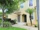 Up close view of a front entrance showcasing a quaint walkway and well-manicured garden at 2856 Oakwater Dr # 2856, Kissimmee, FL 34747