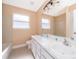 Bathroom boasts dual sinks and neutral tile at 51 Andora Ct, Kissimmee, FL 34758