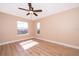 Spacious bedroom with wood-look floors and large window at 51 Andora Ct, Kissimmee, FL 34758