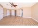 Spacious bedroom with wood-look floors and ceiling fan at 51 Andora Ct, Kissimmee, FL 34758