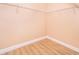 Walk-in closet with wire shelving and wood-look floors at 51 Andora Ct, Kissimmee, FL 34758