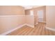 Light-filled hallway with wood-look floors and neutral walls at 51 Andora Ct, Kissimmee, FL 34758