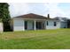 View of the back of the home from the lawn at 519 Lakescape Ct, Orlando, FL 32828