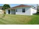 Backyard features the house and the lawn at 519 Lakescape Ct, Orlando, FL 32828