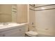 Full bathroom with vanity, toilet, and tiled tub with shower at 519 Lakescape Ct, Orlando, FL 32828