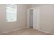Comfortable bedroom with carpet, window, and closet at 519 Lakescape Ct, Orlando, FL 32828