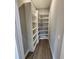 Walk-in pantry with custom shelving provides ample storage space at 0 Sabal St, Orlando, FL 32833