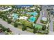 Community amenities featuring a modern pool area, clubhouse, and a basketball court amidst lush landscaping at 10133 Peebles St, Orlando, FL 32827