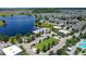 Captivating aerial view featuring the community's recreational amenities and a serene lake setting at 10133 Peebles St, Orlando, FL 32827