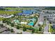 Picturesque aerial view showcases the community's extensive amenities and a scenic lake backdrop at 10133 Peebles St, Orlando, FL 32827