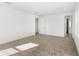 Spacious carpeted bedroom with bright white walls and multiple doorways at 10133 Peebles St, Orlando, FL 32827