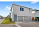 Modern home exterior featuring a two-car garage and stylish curb appeal at 10133 Peebles St, Orlando, FL 32827