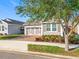 Charming single-Gathering home featuring a decorative garage door, tidy landscaping, and a brick driveway at 349 Alcove Dr, Groveland, FL 34736