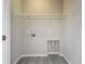 A clean and simple laundry room featuring tile flooring and basic utility connections at 349 Alcove Dr, Groveland, FL 34736