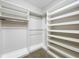 Spacious walk-in closet with ample shelving and storage, maximizing organization at 349 Alcove Dr, Groveland, FL 34736