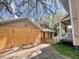 Backyard featuring a garage and fencing, offering a view of the outdoor space at 545 Margaret Ct, Orlando, FL 32801