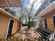 View of the backyard with a garage, partial fencing and an outdoor space, capturing the home's exterior at 545 Margaret Ct, Orlando, FL 32801