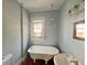 Vintage bathroom featuring a clawfoot tub and classic fixtures at 545 Margaret Ct, Orlando, FL 32801