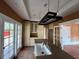 Kitchen with an island, a hanging pot rack, and white cabinets at 545 Margaret Ct, Orlando, FL 32801