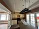 Kitchen with an island, a hanging pot rack, and white cabinets at 545 Margaret Ct, Orlando, FL 32801