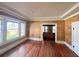 Living room showcasing hardwood floors and a view into an adjacent area, with natural light, creating a comfortable space at 545 Margaret Ct, Orlando, FL 32801