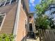 Side view featuring an entrance with stairs and architectural details, providing access to the home at 545 Margaret Ct, Orlando, FL 32801