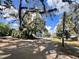 Street view with a mix of residential buildings and mature trees, providing a glimpse of the neighborhood's ambiance at 545 Margaret Ct, Orlando, FL 32801