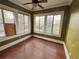 Bright sunroom with hardwood floors, large windows, and natural light at 545 Margaret Ct, Orlando, FL 32801