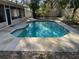 Backyard pool view featuring cool blue waters and patio surround for lounging at 252 Shady Oaks Cir, Lake Mary, FL 32746