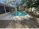 Private swimming pool with concrete patio and screened enclosure, ideal for leisure at 252 Shady Oaks Cir, Lake Mary, FL 32746