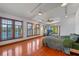 Bedroom with multiple windows overlooking the river and hardwood floors at 360 Rest Haven Rd, Geneva, FL 32732