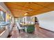 Spacious dining room with exposed-beam ceilings, tile floors, and natural light at 360 Rest Haven Rd, Geneva, FL 32732