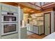 This kitchen features a built-in oven, painted cabinets and a marble counter at 360 Rest Haven Rd, Geneva, FL 32732