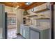 This kitchen features a farmhouse sink, painted cabinets, and an eat-in area at 360 Rest Haven Rd, Geneva, FL 32732