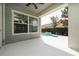 Covered patio with view of small pool and fountain at 7508 Lake Albert Dr, Windermere, FL 34786